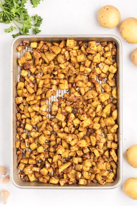 Cooked potatoes on a baking sheet.