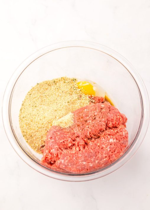 A bowl with ingredients to make Salisbury Steak.