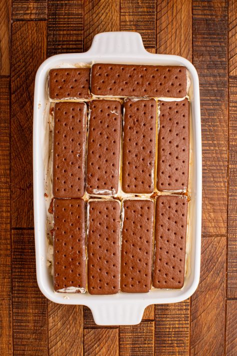 More ice cream sandwiches on top of layered dessert.
