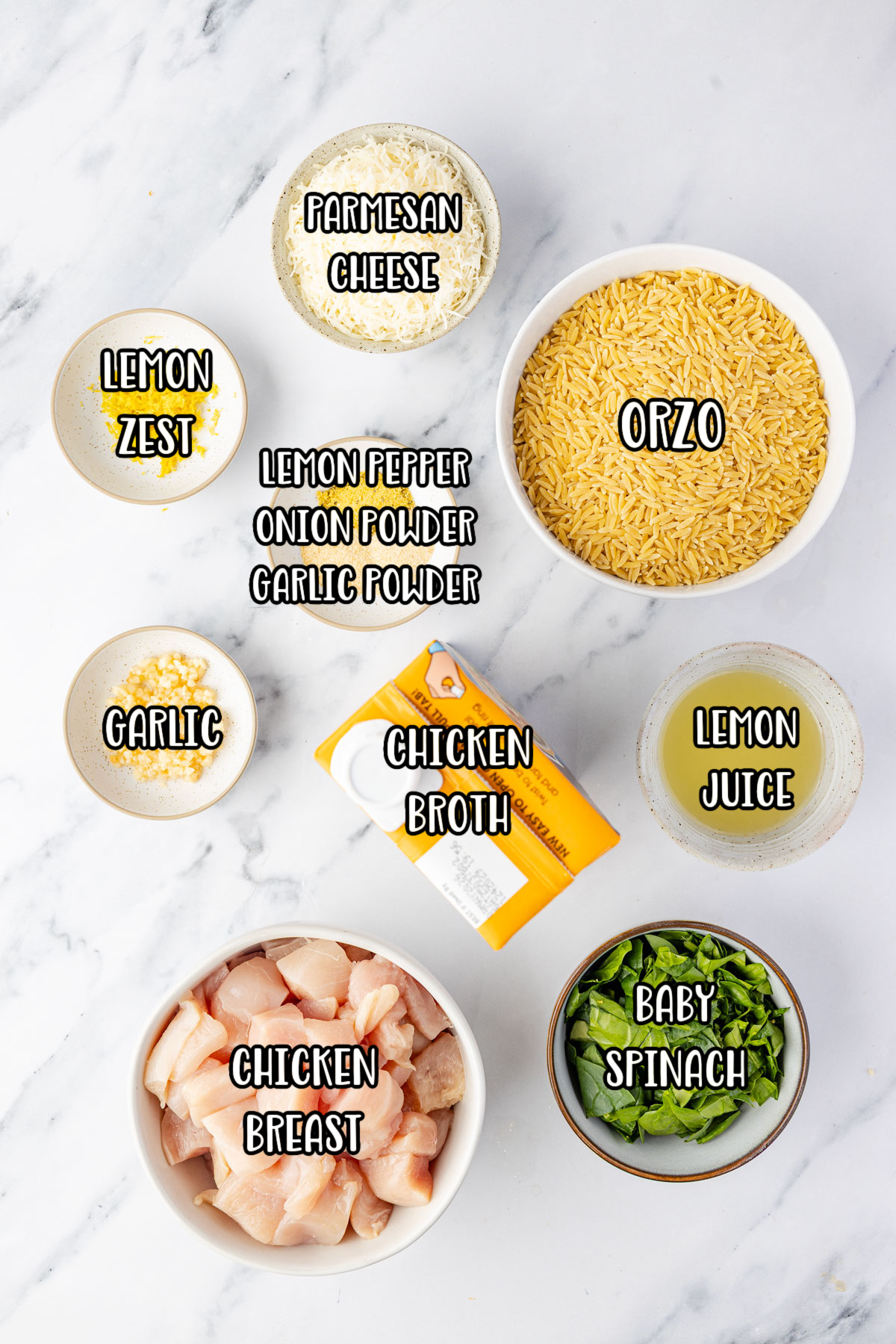 Chicken breasts, chicken broth, orzo pasta, lemon zest, lemon juice, garlic, lemon pepper seasoning, onion powder, garlic powder, Parmesan cheese, and baby spinach.