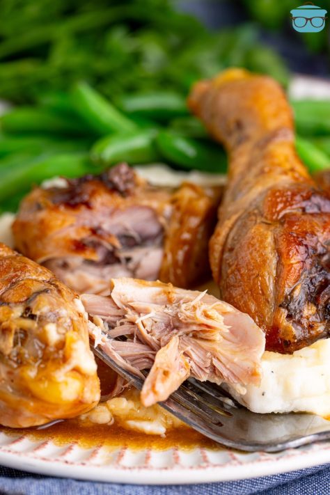 A partial eaten Mississippi Chicken Leg with a few behind it.