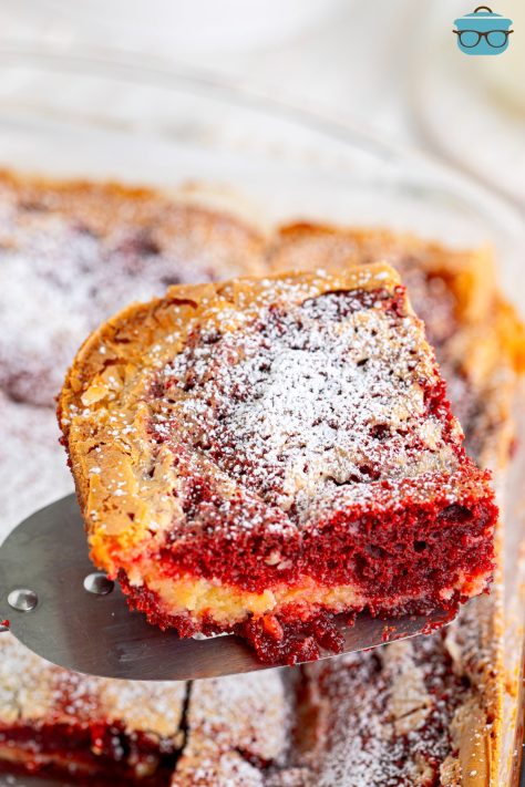A corner piece of Red Velvet Gooey Butter Cake.