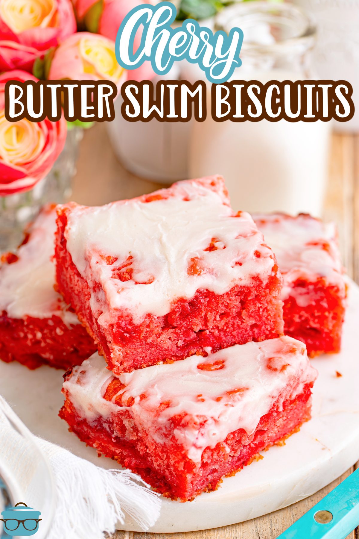 Three Cherry Butter Swim Biscuits on a plate.