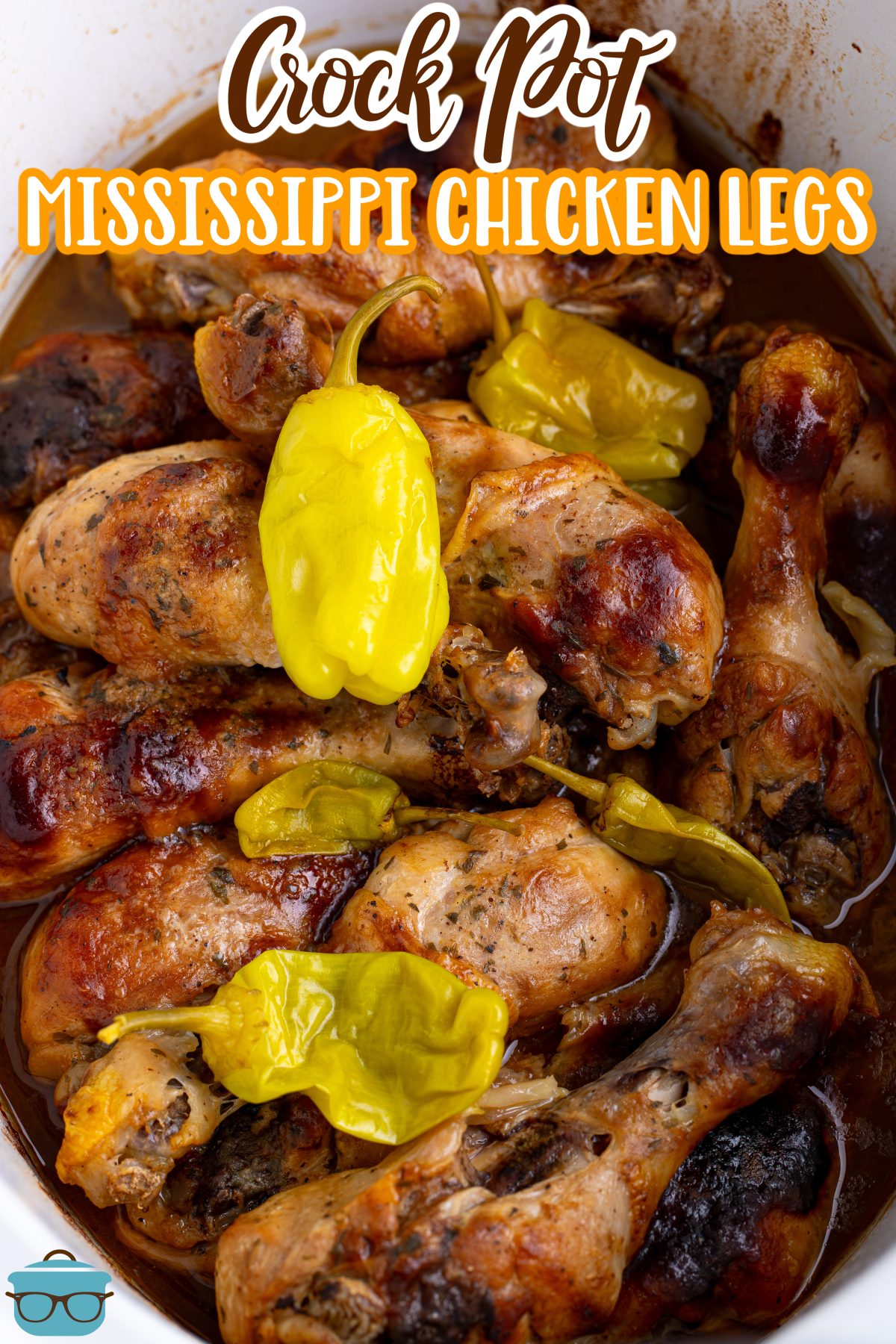 Looking down on a full Slow Cooker of Mississippi Chicken Legs with pepperoncinis.