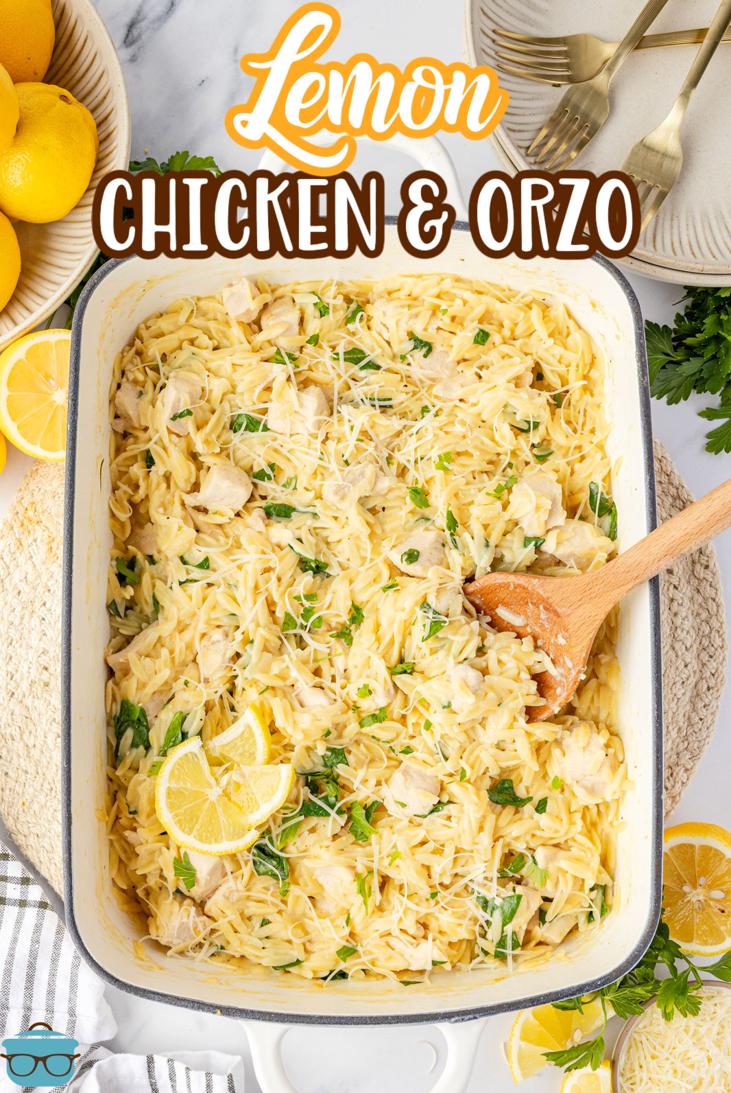 A baking dish with a serving utensil in the Lemon Chicken and Orzo.