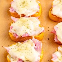 Looking down on a few Ham and Swiss Texas Toast on a baking sheet.
